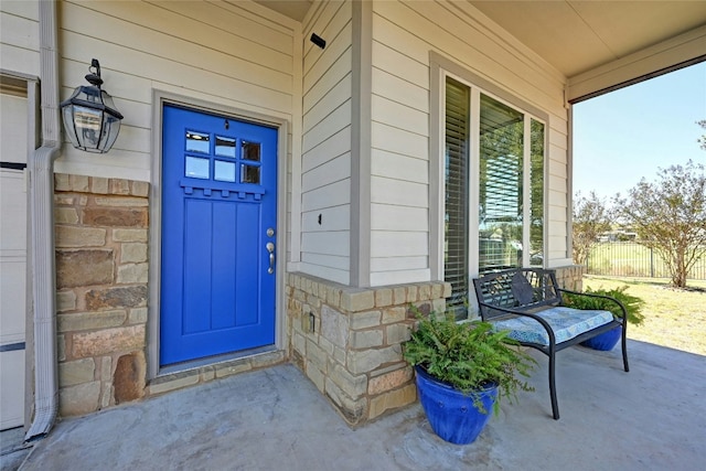 property entrance featuring covered porch