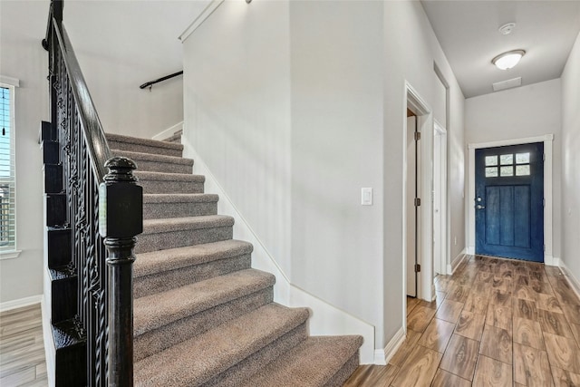 entryway with wood-type flooring and a wealth of natural light