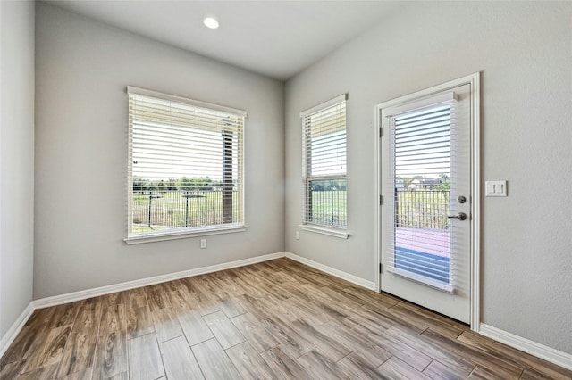 spare room with light hardwood / wood-style floors