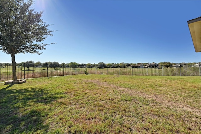 view of yard with a rural view