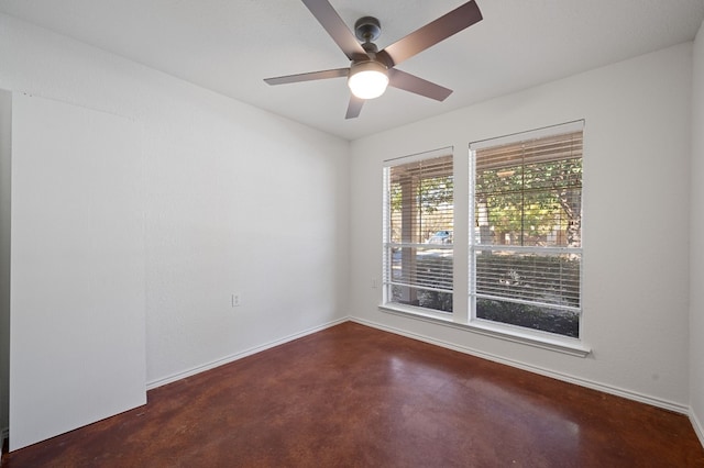 unfurnished room with ceiling fan