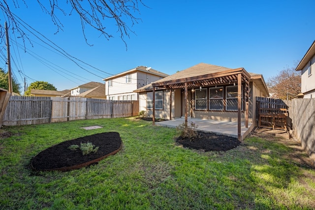 back of house featuring a yard and a patio area