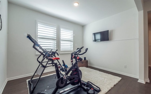 exercise area with dark hardwood / wood-style floors