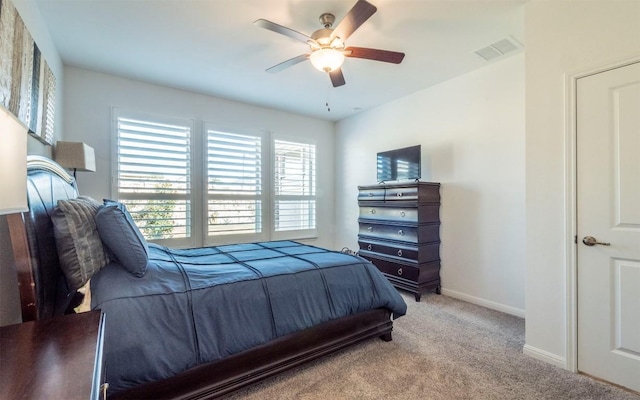 bedroom with light colored carpet and ceiling fan