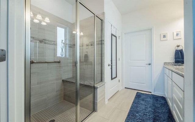 bathroom featuring vanity and a shower with shower door