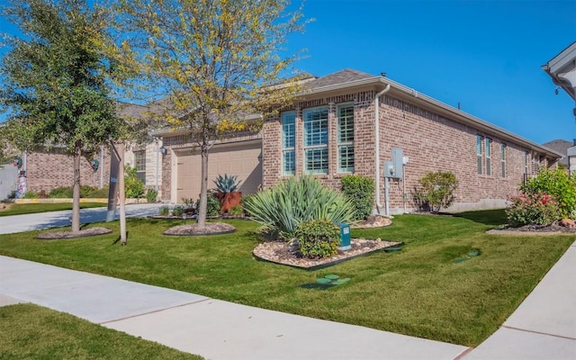 view of front of property featuring a garage and a front yard