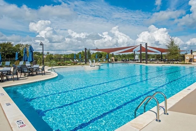 view of swimming pool featuring a patio