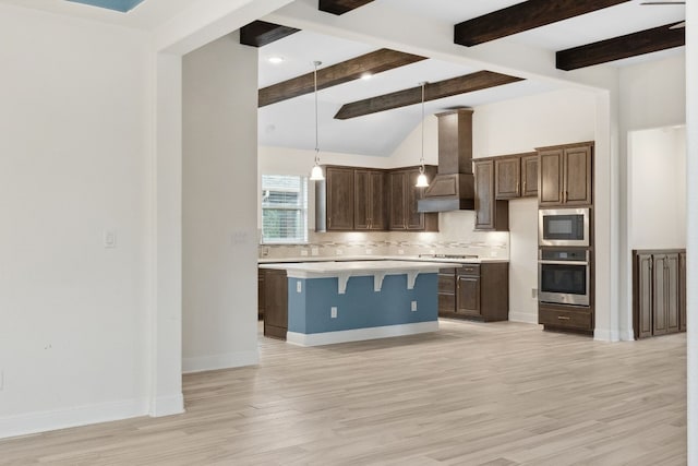 kitchen with premium range hood, stainless steel appliances, light hardwood / wood-style flooring, a center island, and hanging light fixtures