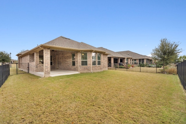 5152 Cornetto Blfs, Round Rock, TX 78665 - back of house with brick siding, a patio area, and roof with shingles