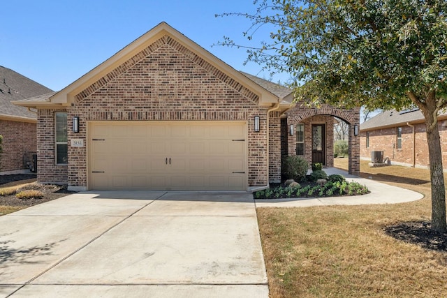 view of front of property with brick siding, central AC, concrete driveway, and a garage