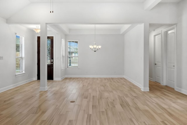 5152 Cornetto Blfs, Round Rock, TX 78665 - unfurnished dining area with a chandelier, light wood-style floors, and baseboards