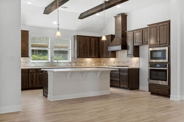5152 Cornetto Blfs, Round Rock, TX 78665 - kitchen featuring stainless steel appliances, custom range hood, light countertops, and decorative backsplash