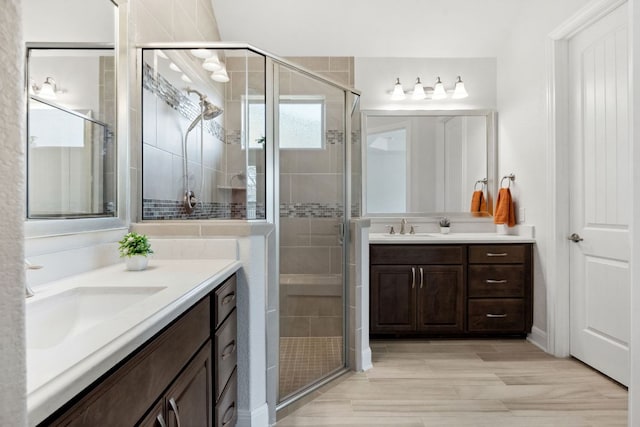 5152 Cornetto Blfs, Round Rock, TX 78665 - full bathroom featuring two vanities and a stall shower