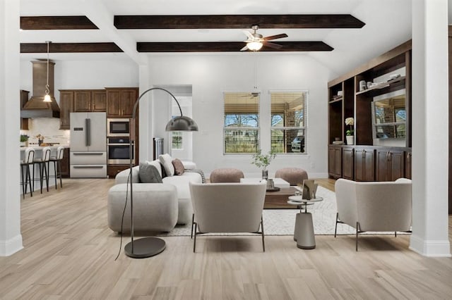 5152 Cornetto Blfs, Round Rock, TX 78665 - living room featuring light wood-type flooring, a ceiling fan, beamed ceiling, and baseboards