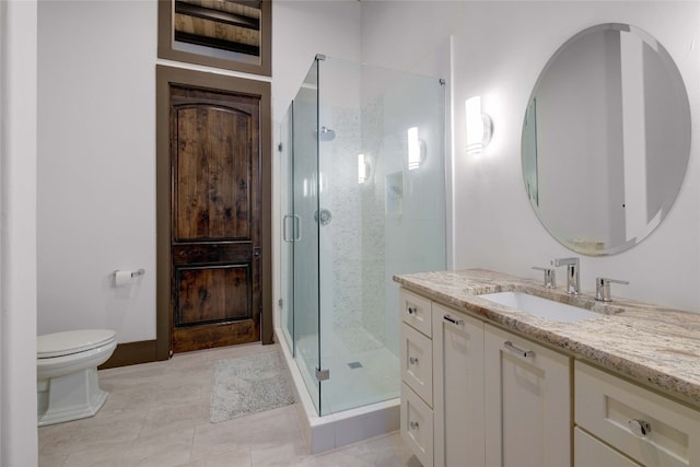 bathroom with toilet, vanity, tile patterned floors, and a shower with door