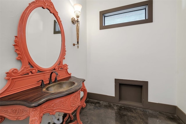 bathroom featuring vanity and concrete flooring