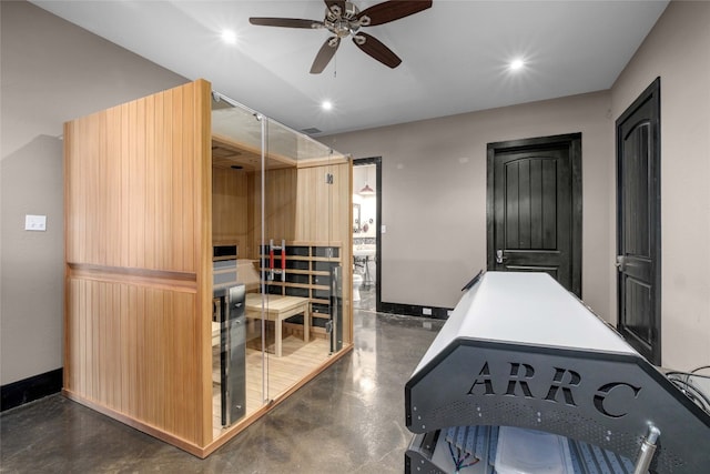 interior space with ceiling fan