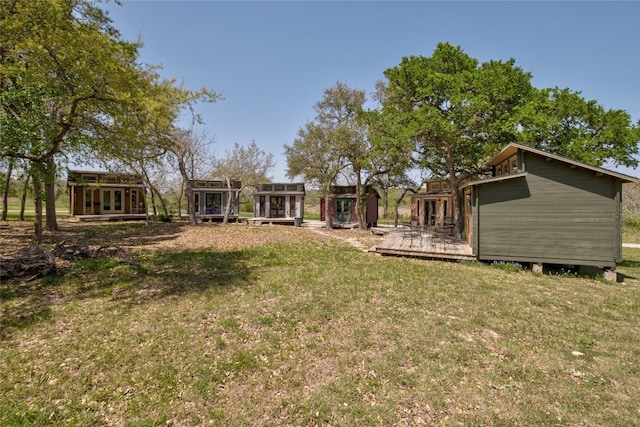 view of yard featuring a wooden deck