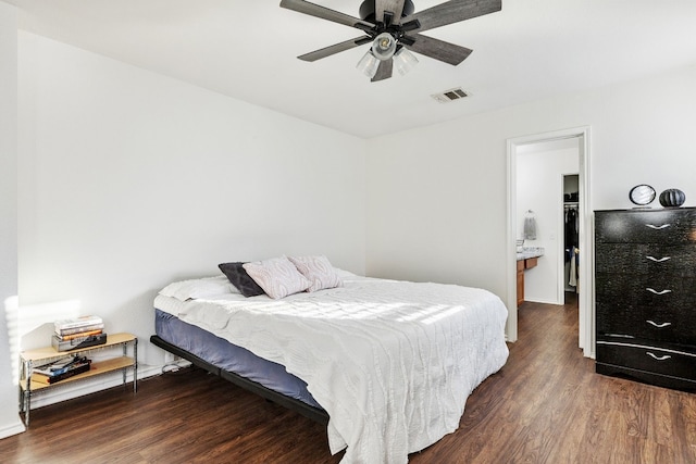 bedroom with ceiling fan and dark hardwood / wood-style floors