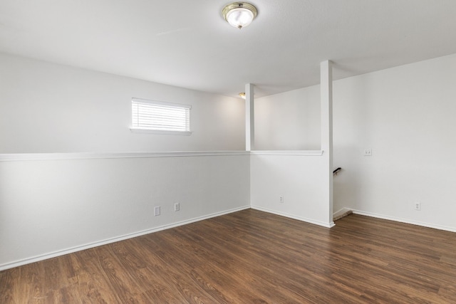 basement with dark wood-type flooring