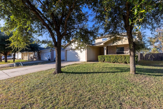 single story home with a garage and a front yard