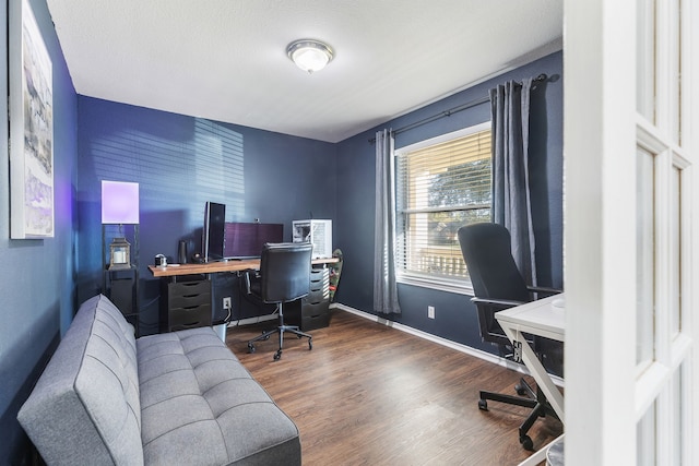 office area featuring dark hardwood / wood-style flooring and a textured ceiling