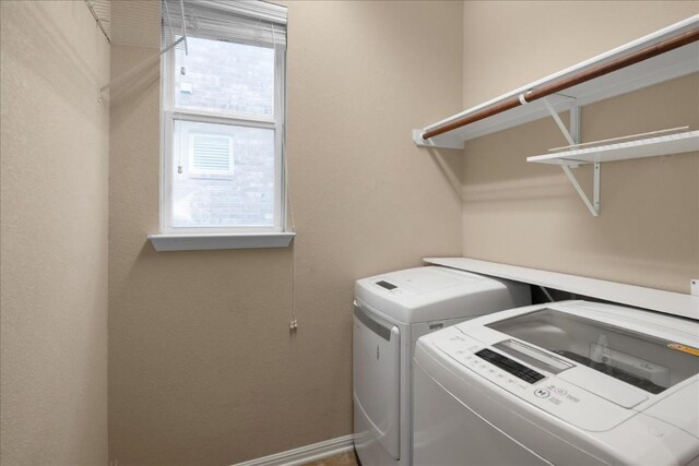 laundry room with washing machine and dryer