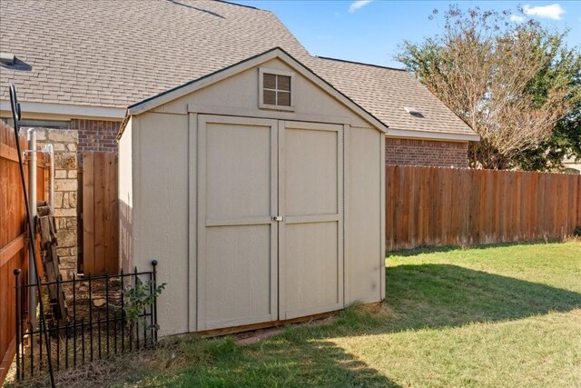 view of outbuilding featuring a yard