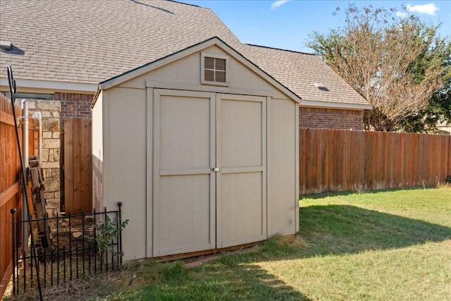 view of shed with fence