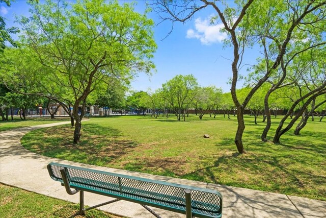 view of home's community featuring a lawn