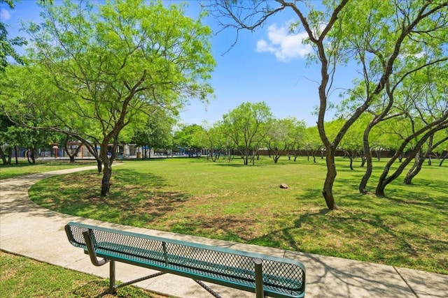 view of property's community with a yard