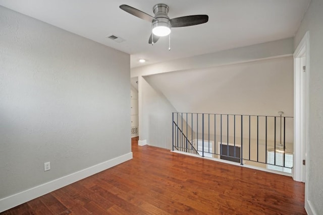 unfurnished room with wood-type flooring and ceiling fan