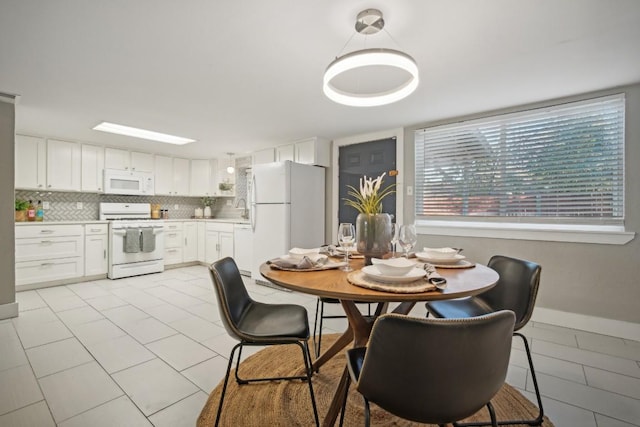 dining space with sink