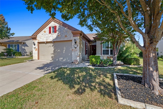 view of front of home featuring a garage and a front lawn