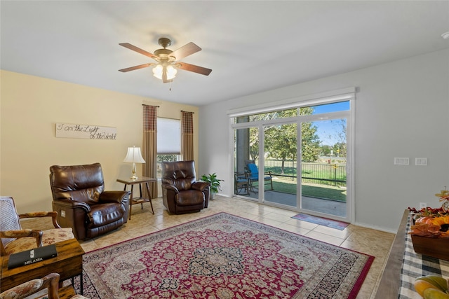 tiled living room featuring ceiling fan