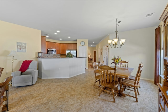 dining area featuring an inviting chandelier