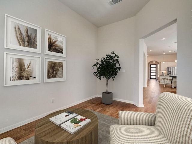 sitting room featuring hardwood / wood-style floors