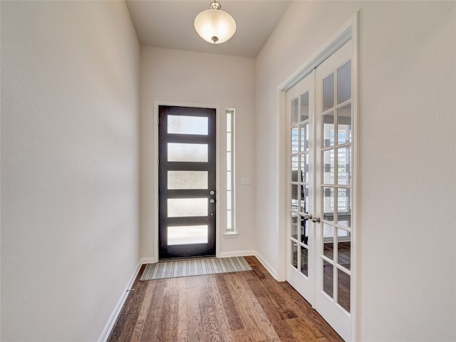 entrance foyer with french doors and dark hardwood / wood-style flooring