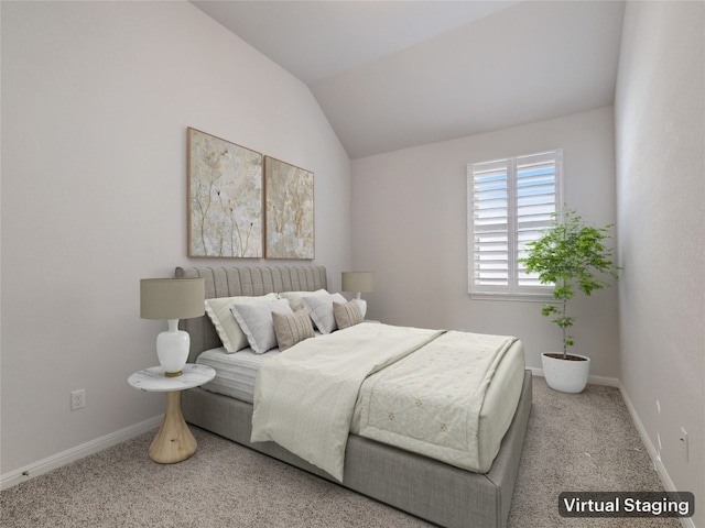 carpeted bedroom with vaulted ceiling