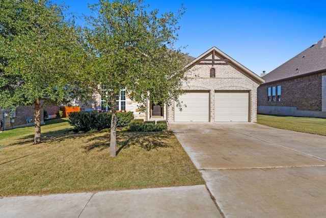 view of front of house featuring a front yard and a garage