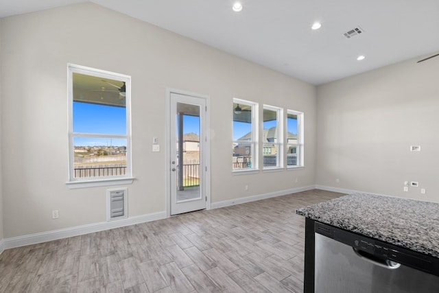 interior space featuring light hardwood / wood-style floors and lofted ceiling