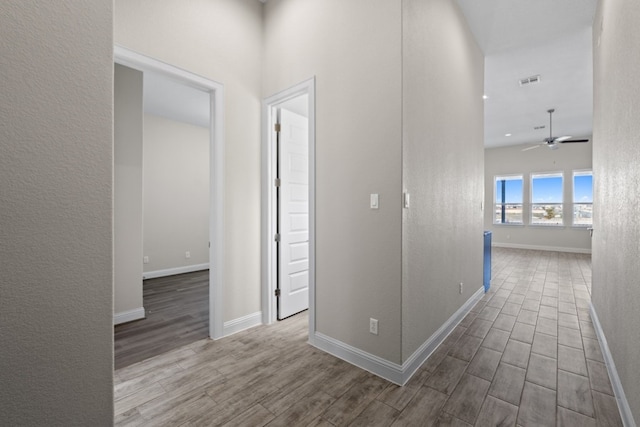 corridor featuring wood-type flooring