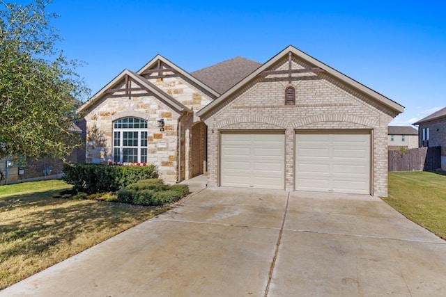 view of front of home featuring a garage and a front yard