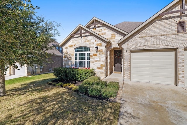 view of front of home with a front lawn and a garage