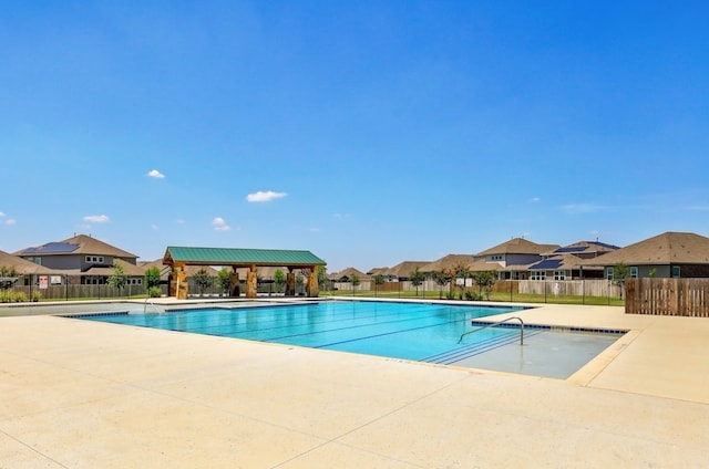 view of swimming pool with a gazebo and a patio