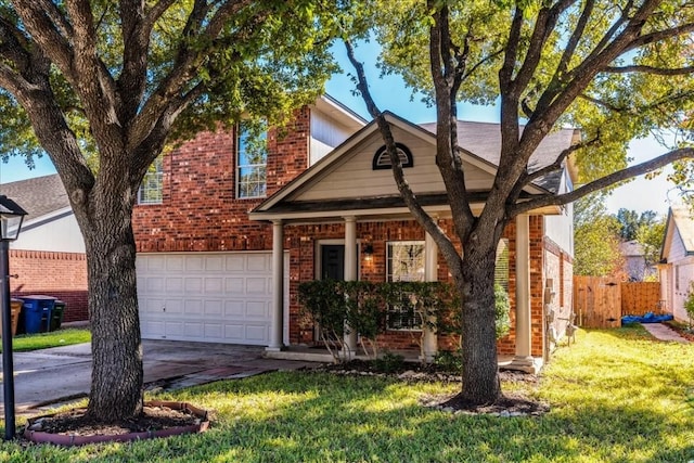 view of front of house featuring a front yard and a garage