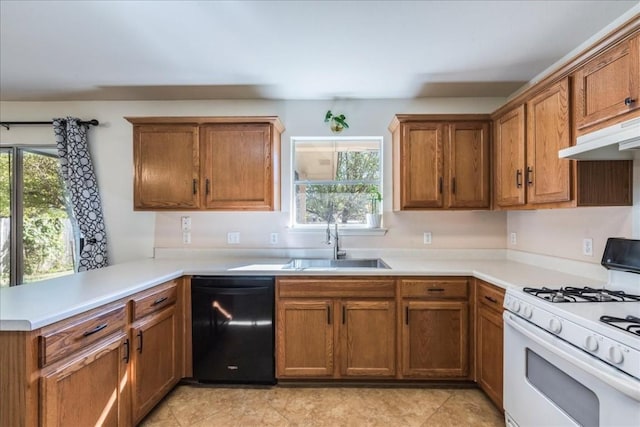 kitchen featuring dishwasher, light tile patterned floors, white gas range oven, and sink