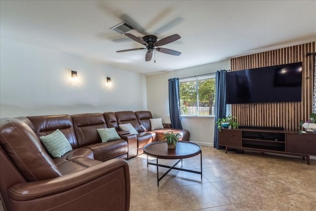 living room featuring ceiling fan and light tile patterned flooring