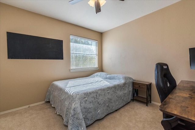 bedroom with ceiling fan and light colored carpet