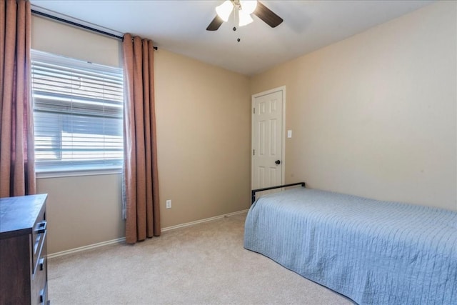 bedroom featuring ceiling fan and light colored carpet